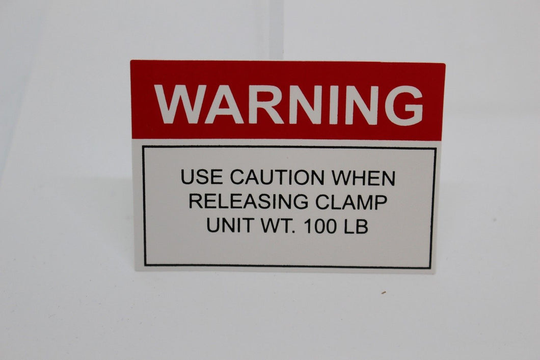 Warning Use Caution When Releasing Clamp Unit Wt. 100 lb Decal, New